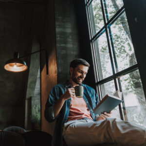 Happy Male Resting With Coffee And Volume